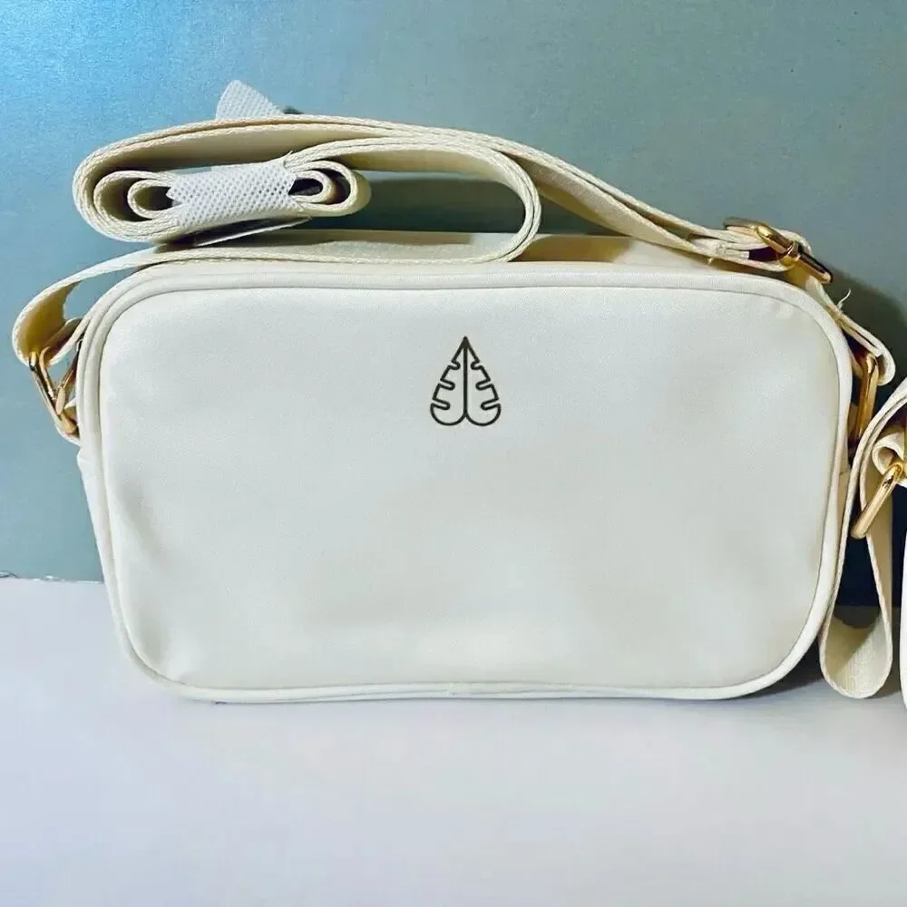 NWT Gorgeous Biossance White/ Ivory Satin Light Cushion adjustable crossbody bag